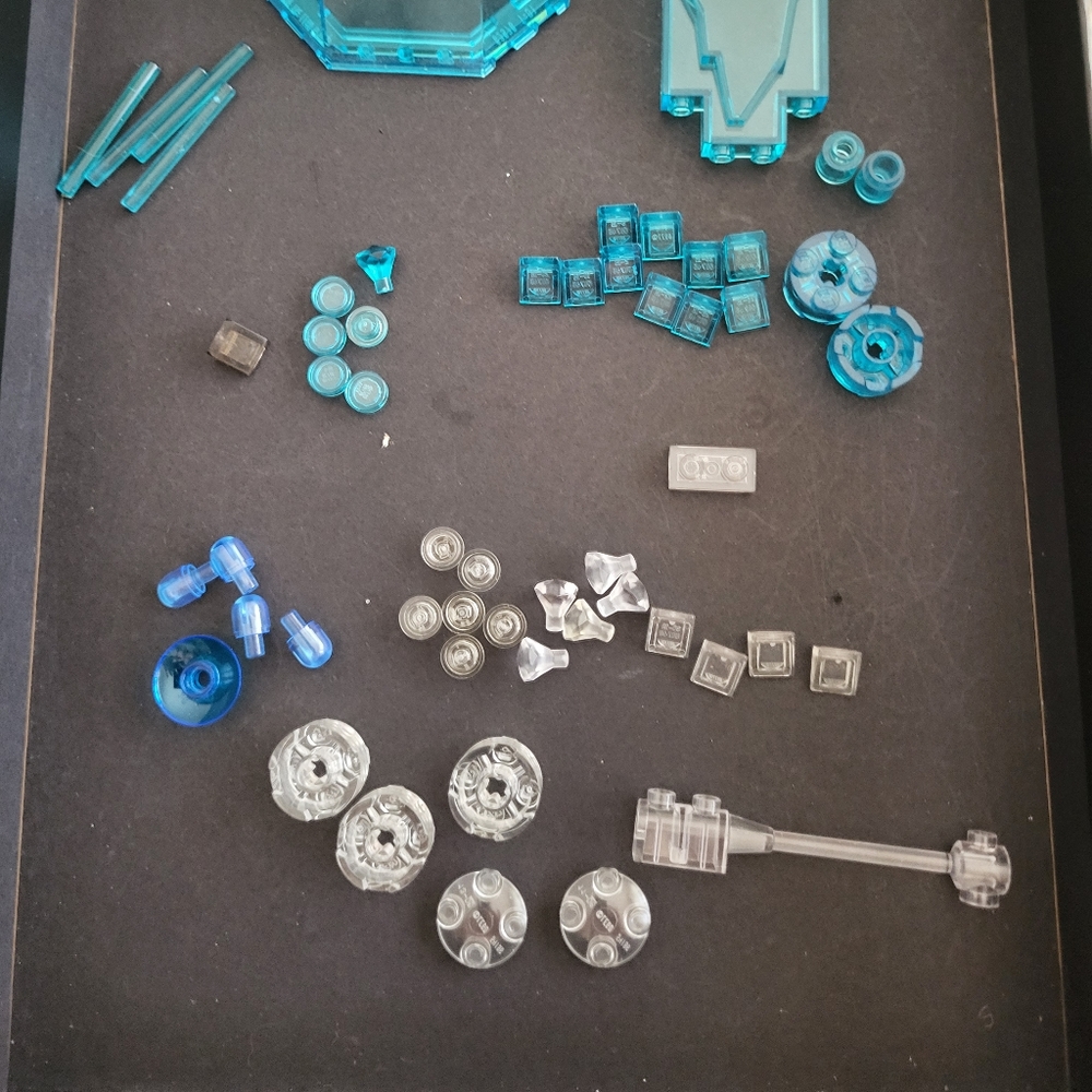 Lego lot of assorted blue and clear "crystal/glass" pieces. 54 pieces total